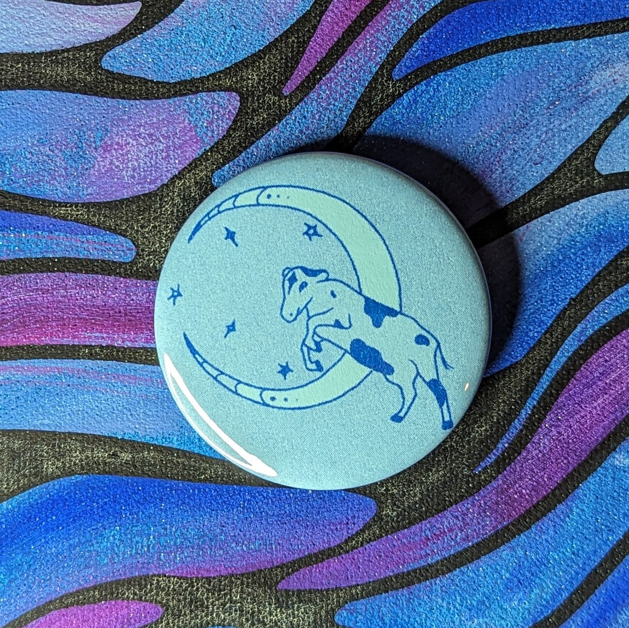 cow jumping over moon button