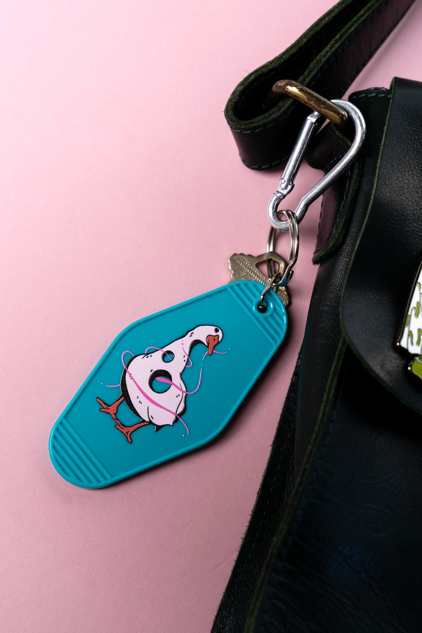 silly goose motel keychain