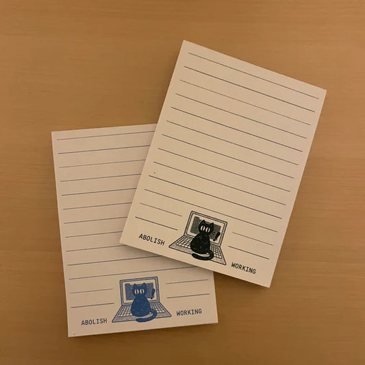 Abolish Working blue notepad
